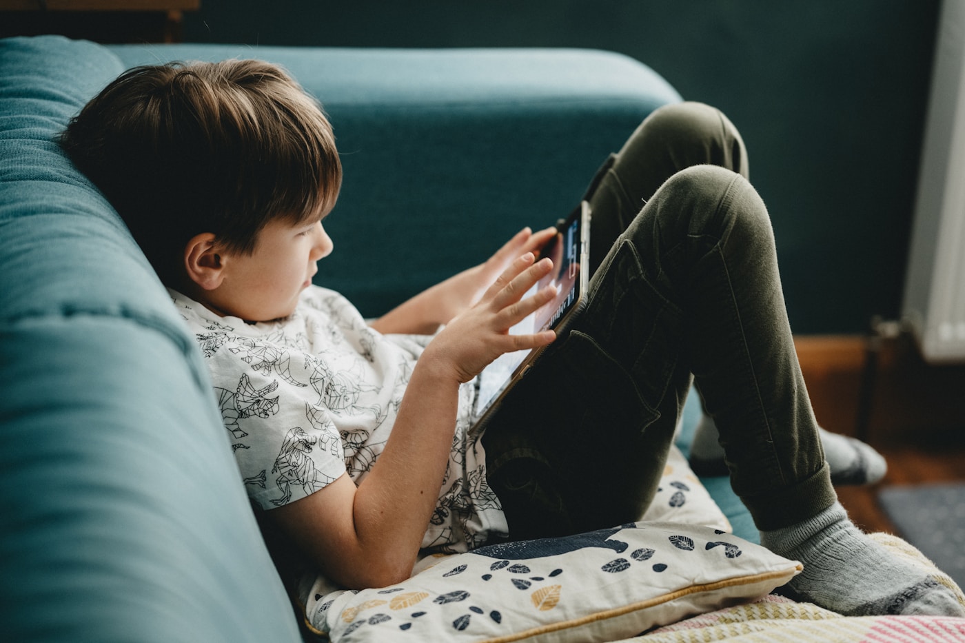 A child using the Lost in Learning app on a tablet